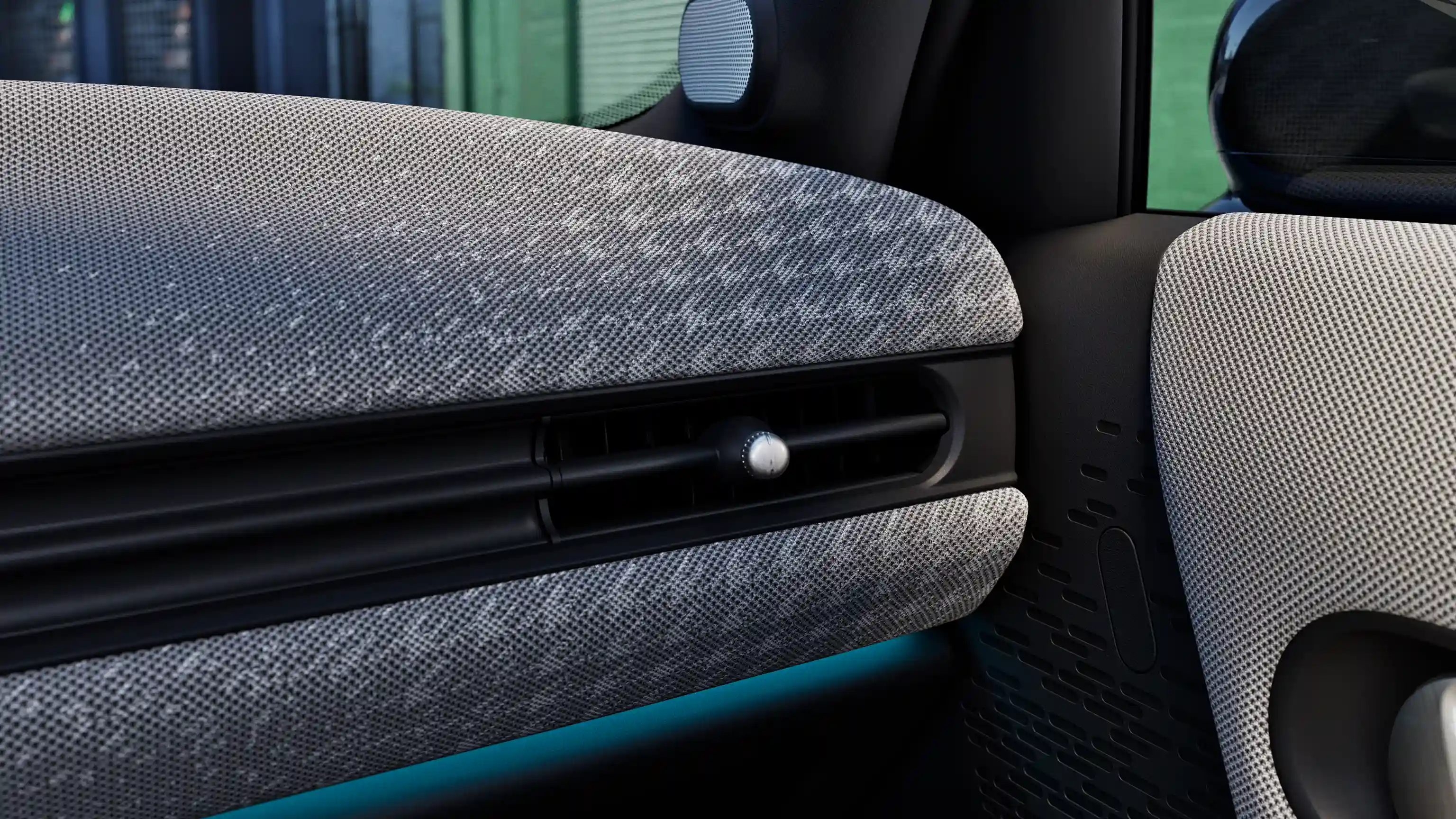 Detail view of the MINI Cooper 5-Door dashboard with blue ambient light