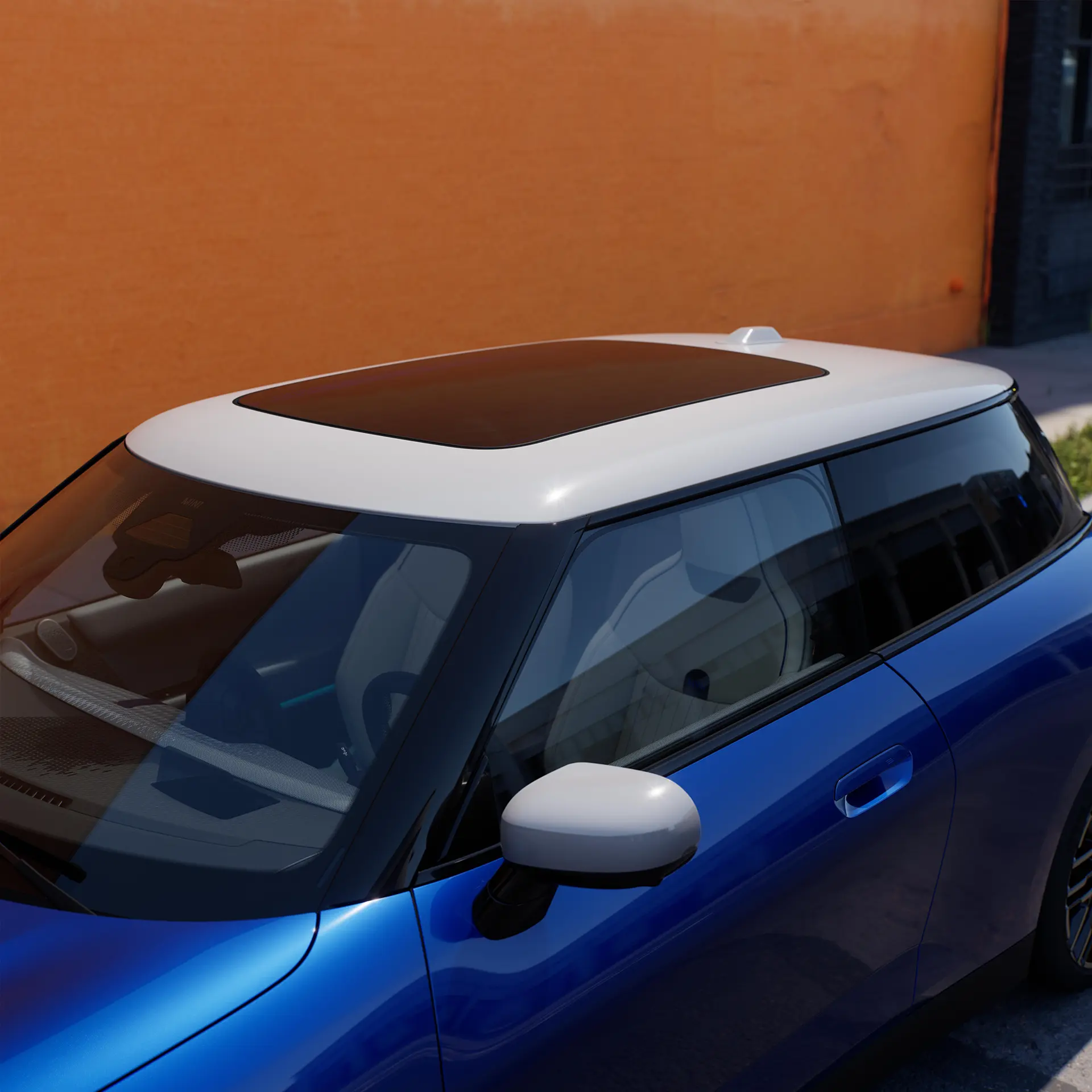 Top view of all-electric MINI Cooper in Blue with contrast roof and big glass roof.