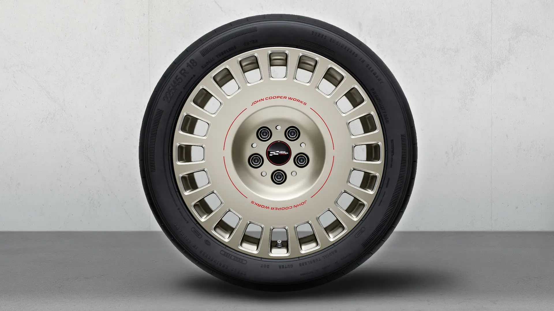 Close-up of the 18'' JCW Rallye Spoke 992 wheel showing the two-tone design detail in Vibrant Silver and gloss-milled finish.