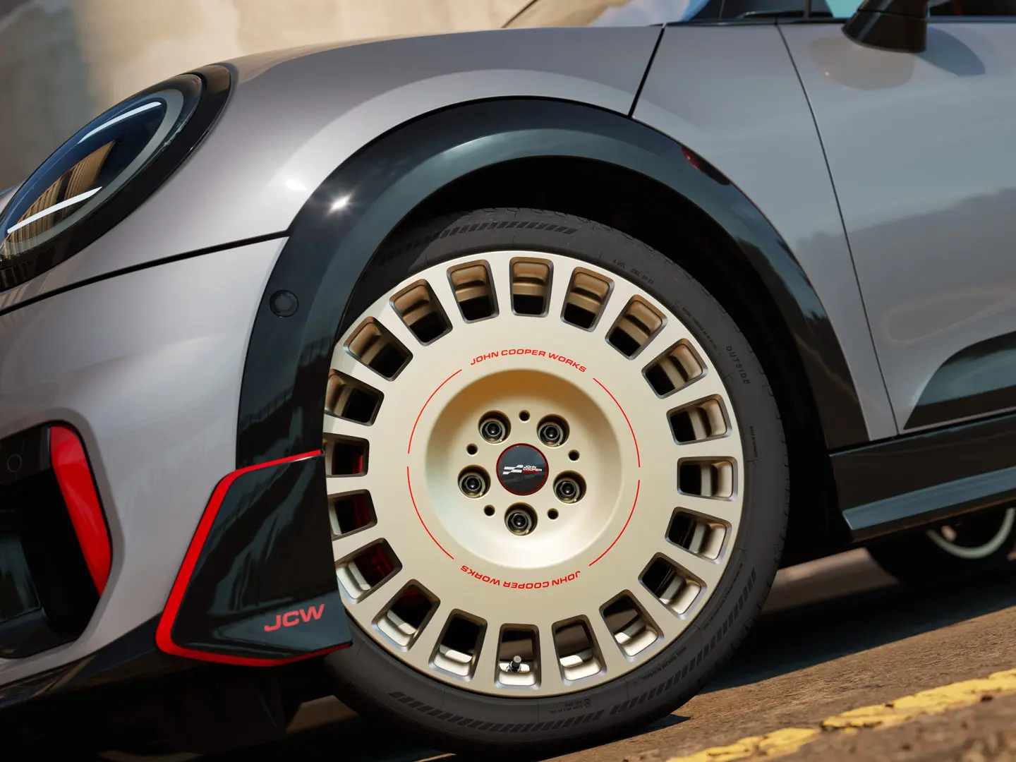 Close-up of the details on an 18" JCW Rallye Spoke 964 wheel in Bicolour Vibrant Silver, diamond-milled and front winglet.