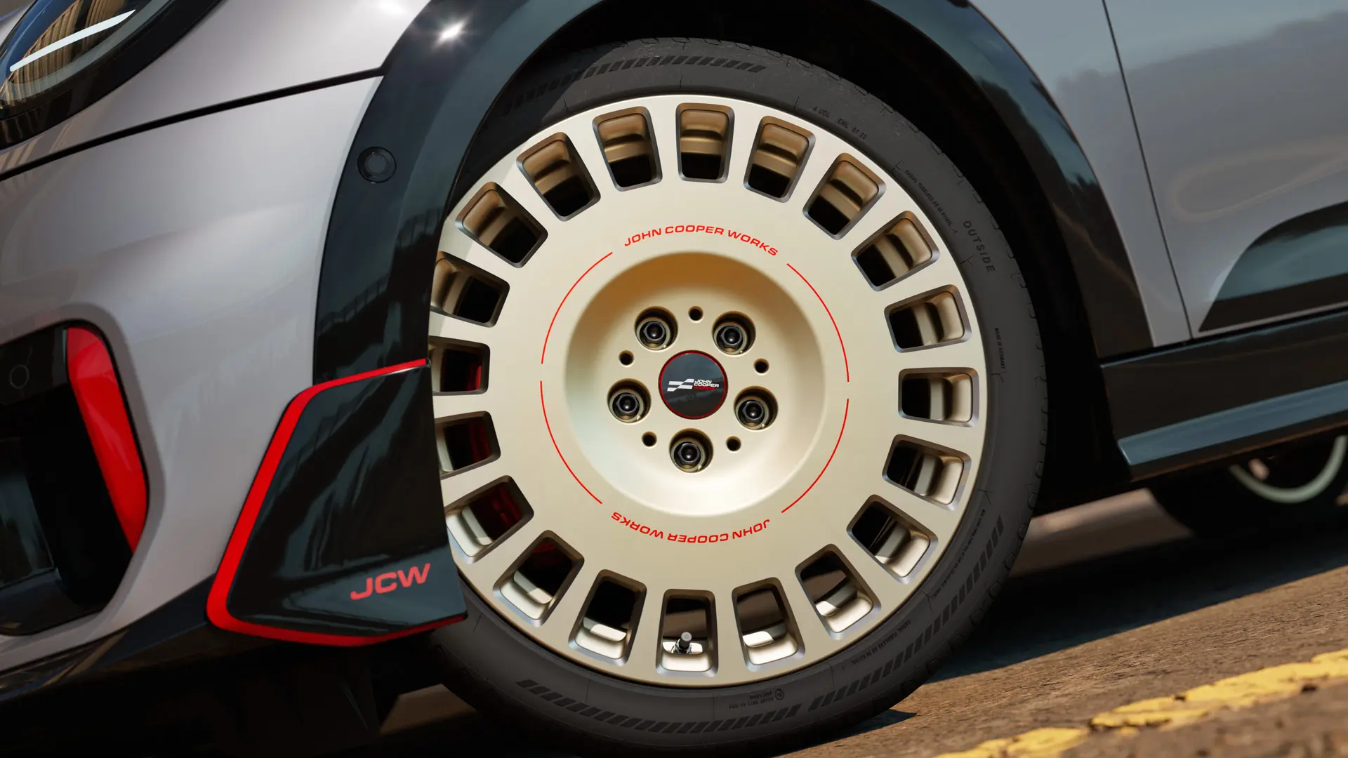 Close-up of the details on an 18" JCW Rallye Spoke 964 wheel in Bicolour Vibrant Silver, diamond-milled and front winglet.