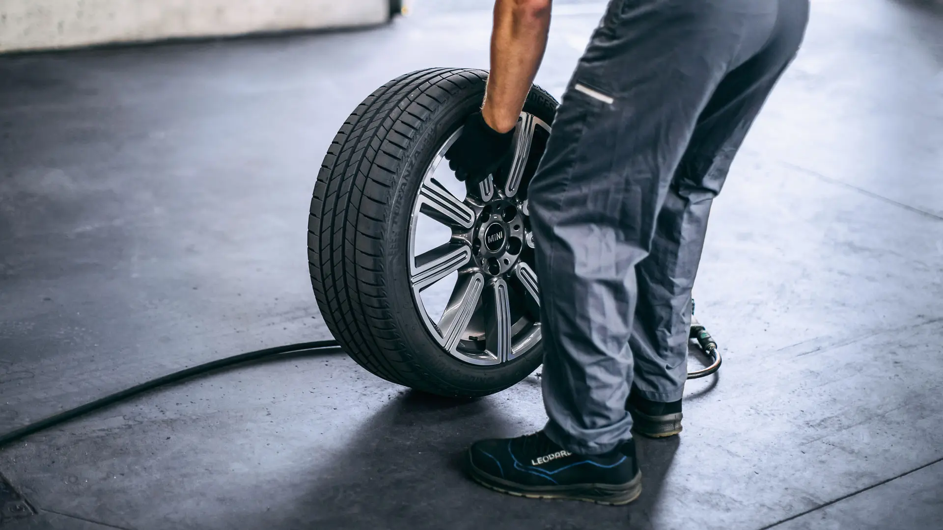 MINI employee checking a tyre