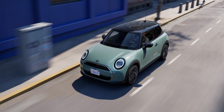 MINI Cooper 3-door driving down the street