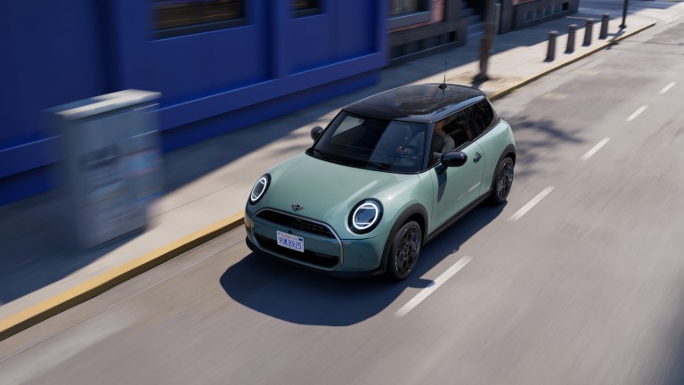 MINI Cooper 3-door driving down the street