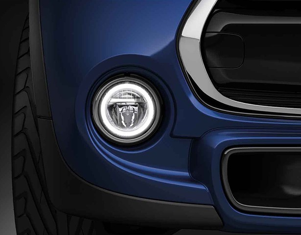 Front of blue car showing headlights.