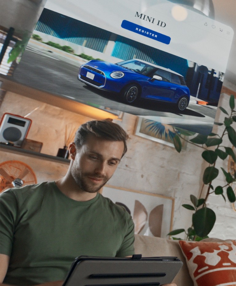 Customer exploring how to buy a MINI from the comfort of their sofa
