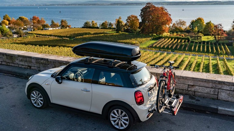 MINI Electric overlooking a beautiful countryside lake