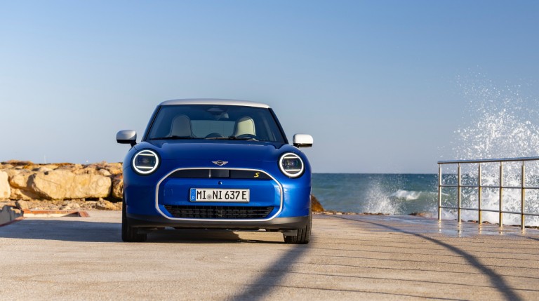 all-electric MINI Cooper driving in countryside