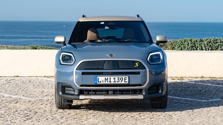 all-electric MINI Countryman front view with sea behind