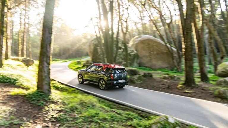 MINI Countryman John Cooper Works  side and rear driving through forest