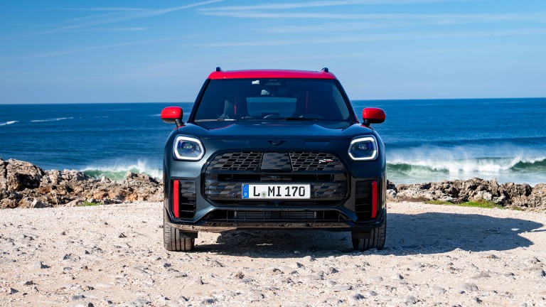 MINI Countryman John Cooper Works front view on beach with sea in the background