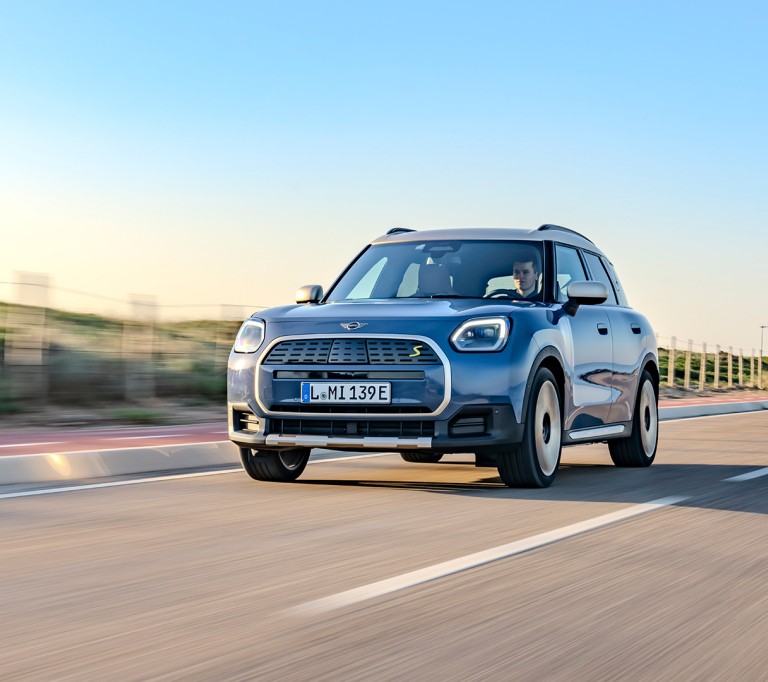 all-electric MINI Countryman driving down the road